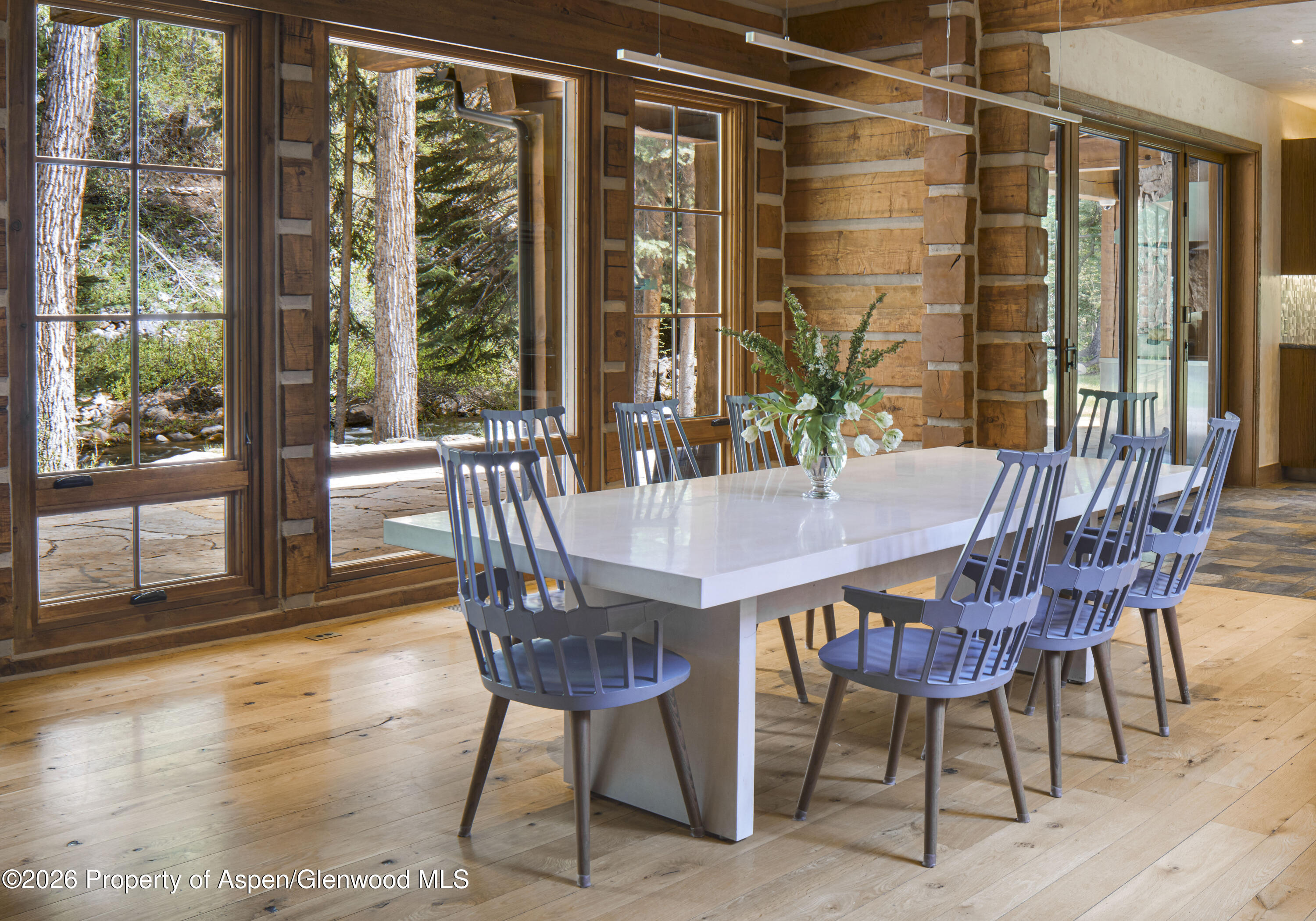 143 Conundrum Creek Road Aspen, CO 81611 - Photo 7 of 16 a view of a dining room with furniture window and wooden floor
