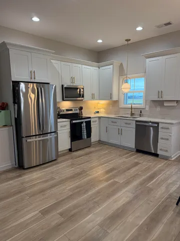 a bedroom with bed and window