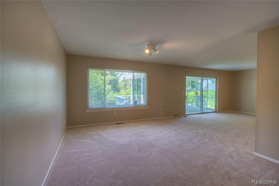 736 Dressler Lane Rochester, MI 48307 - Photo 5 of 20 Enter the large open Family Room with all new carpet and a fresh coat of neutral paint throughout the entire home.