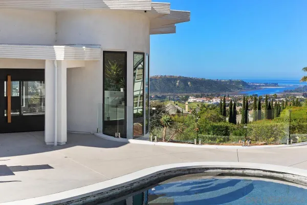 a view of a patio with table and chairs