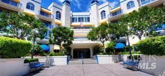 a front view of a building with a garden