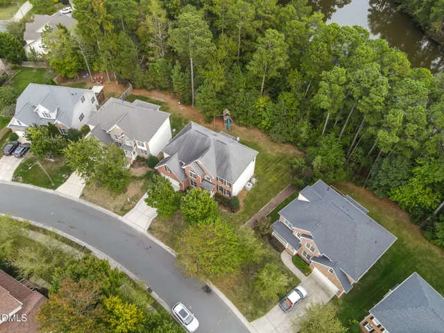 an aerial view of a house with a garden