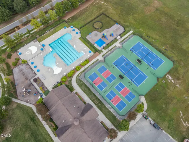 swimming pool view with trees in the background