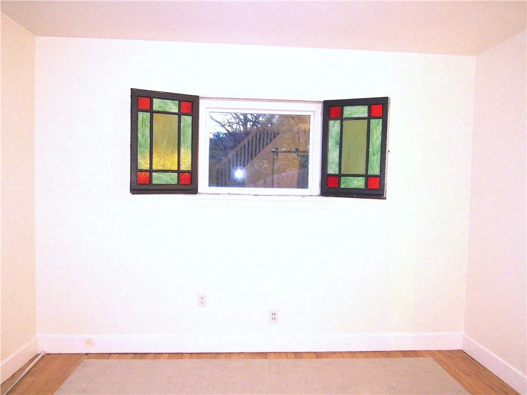 201 Friday Road Pittsburgh, PA 15209 - Photo 26 of 39 a picture of a wall with a book shelf