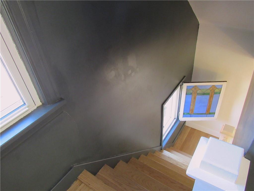 201 Friday Road Pittsburgh, PA 15209 - Photo 29 of 39 View from the 2nd floor of the hardwood staircase and Vintage 1920's Stain Glass Window.