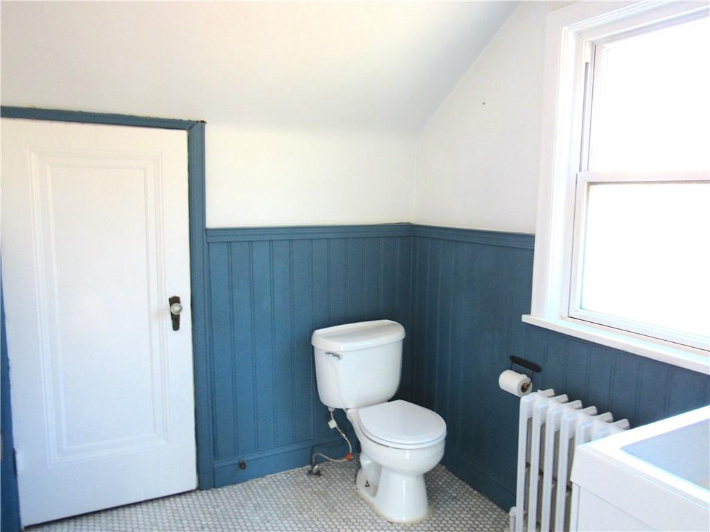 201 Friday Road Pittsburgh, PA 15209 - Photo 32 of 39 a white toilet sitting next to a bathroom sink