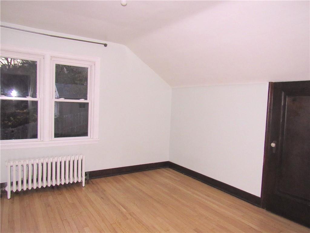 201 Friday Road Pittsburgh, PA 15209 - Photo 34 of 39 an empty room with wooden floor and windows