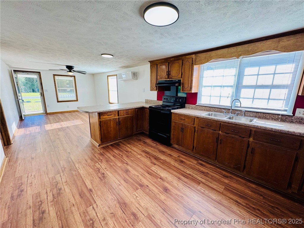 790 Old Whiteville Road Lumberton, NC 28358 - Photo 11 of 29 a kitchen with stainless steel appliances granite countertop a sink stove and wooden cabinets