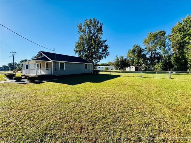 a view of a swimming pool with an outdoor space and seating area