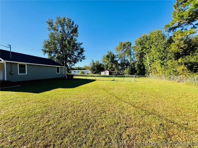 a view of a swimming pool with an outdoor space