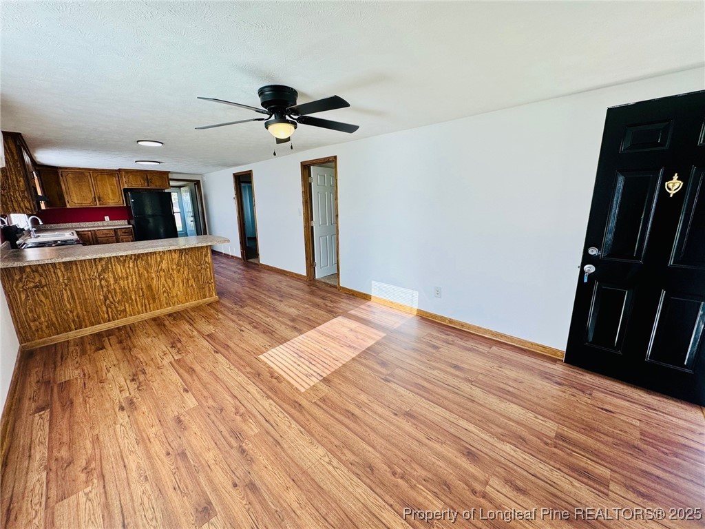 790 Old Whiteville Road Lumberton, NC 28358 - Photo 5 of 29 a view of empty room with wooden floor