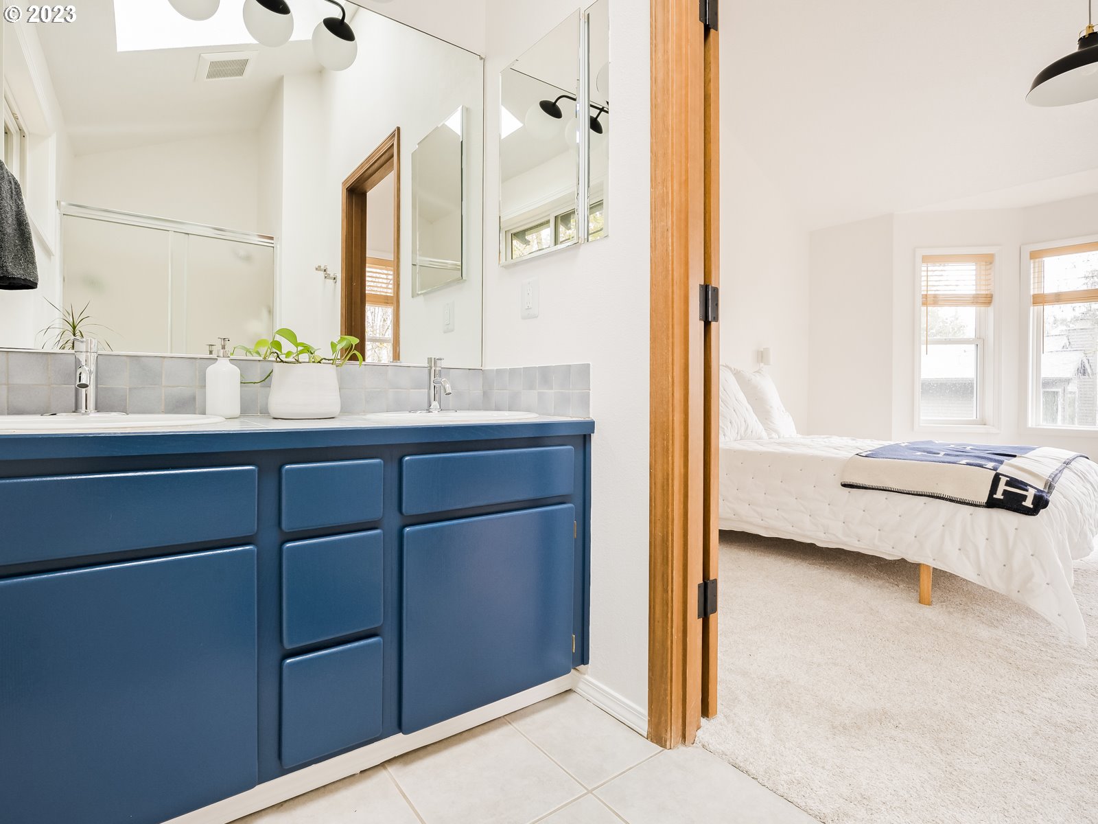 5928 Southwest Yamhill Street Portland, OR 97221 - Photo 12 of 25 a en suite bathroom with a tub sink and mirror