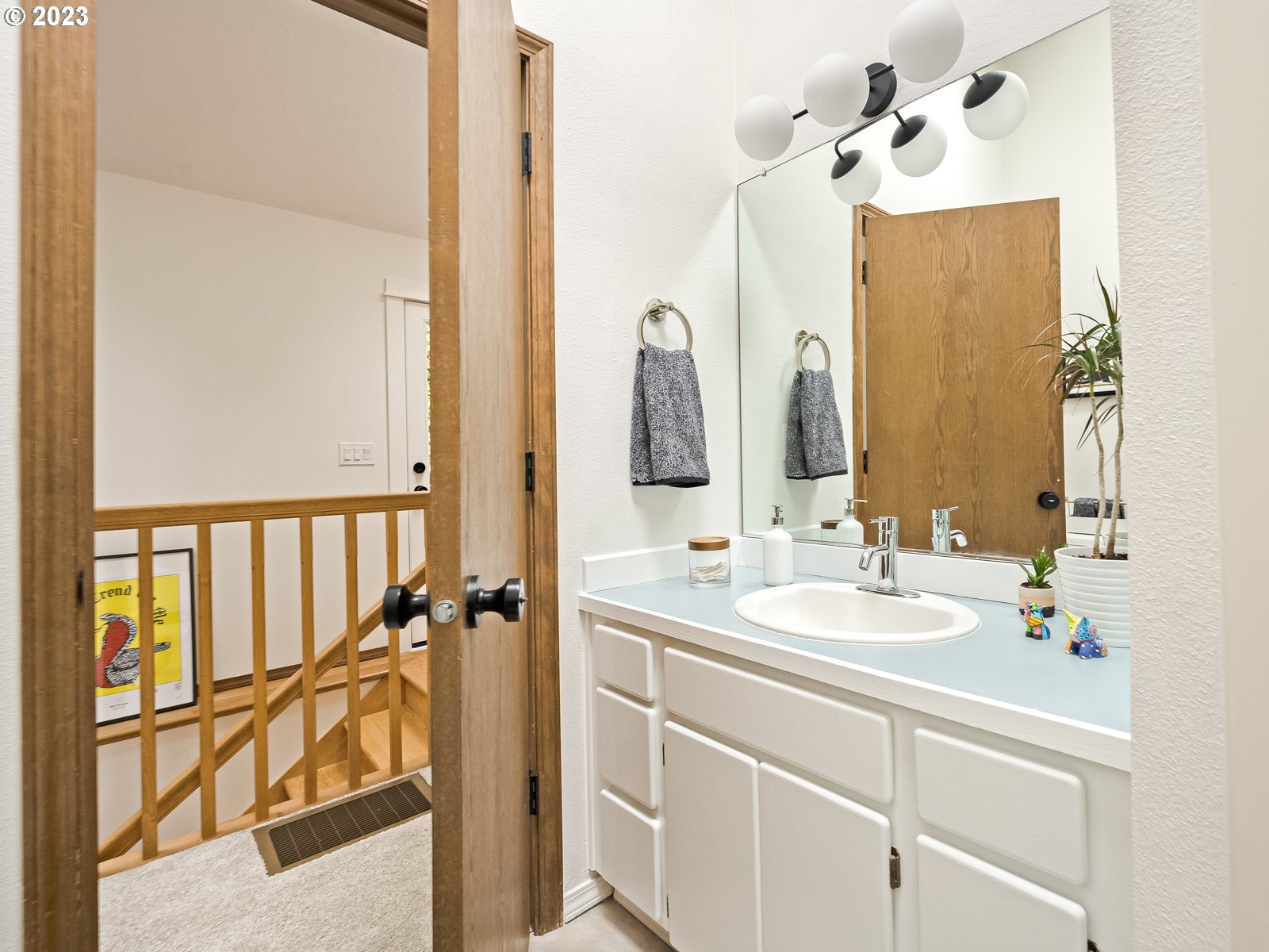 5928 Southwest Yamhill Street Portland, OR 97221 - Photo 15 of 25 a bathroom with a double vanity sink and mirror