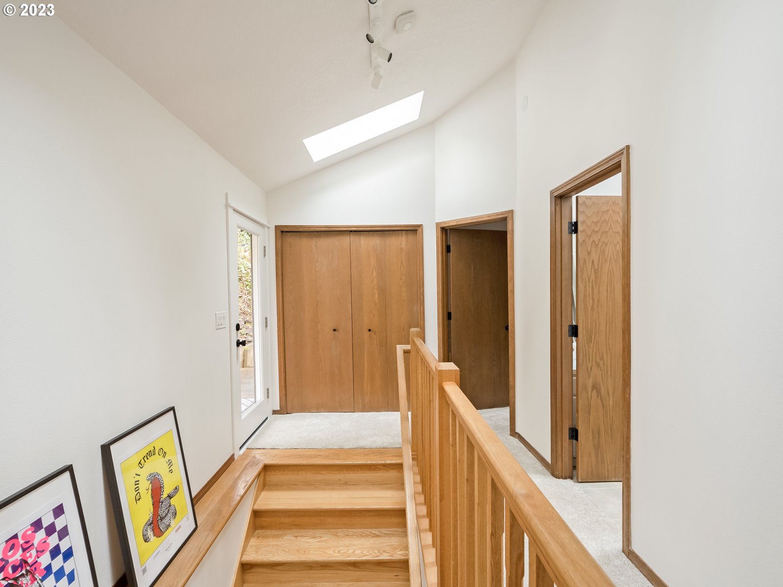 5928 Southwest Yamhill Street Portland, OR 97221 - Photo 17 of 25 a view of a hallway with wooden floor and entryway