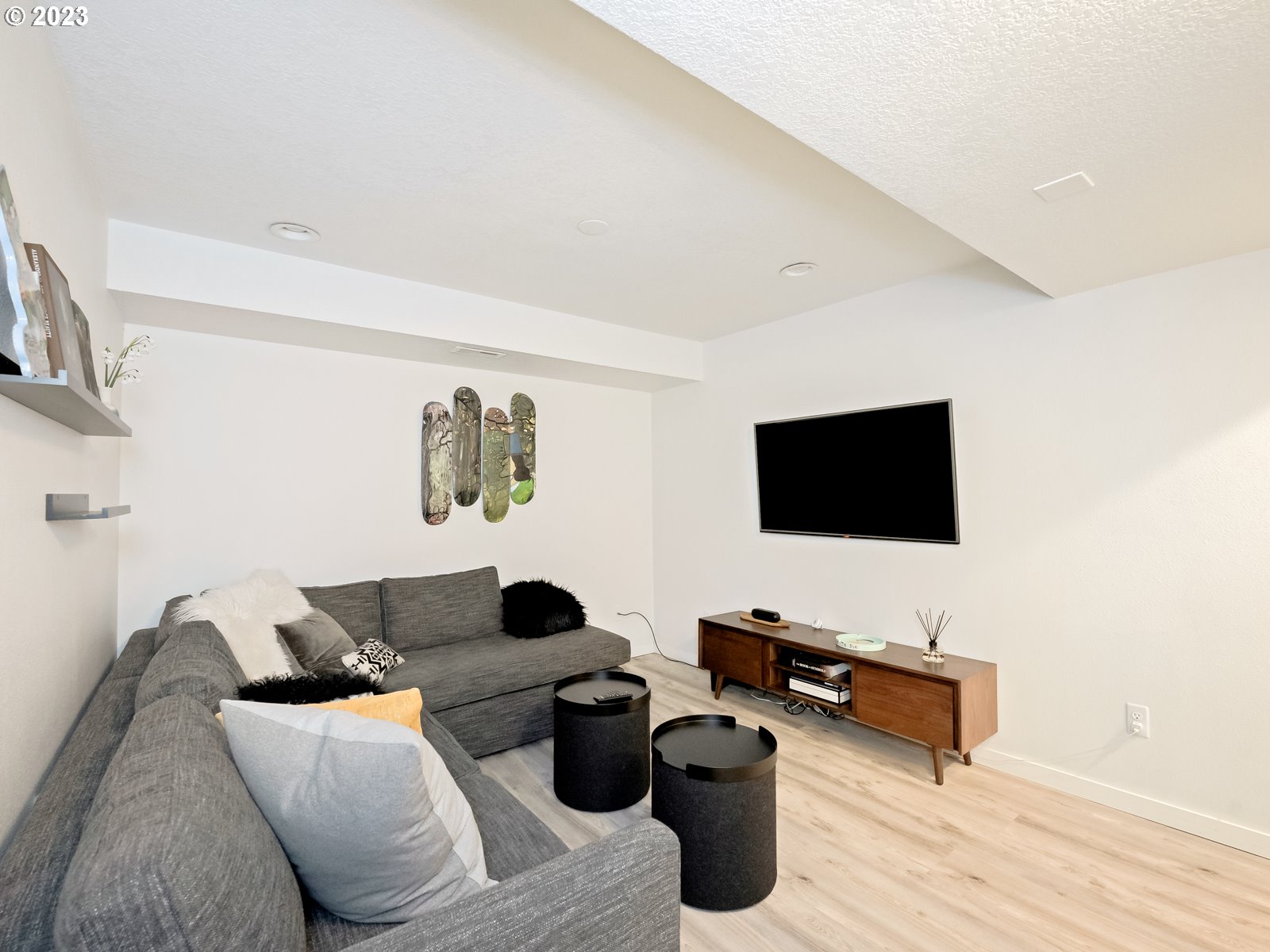5928 Southwest Yamhill Street Portland, OR 97221 - Photo 18 of 25 a living room with furniture and a flat screen tv