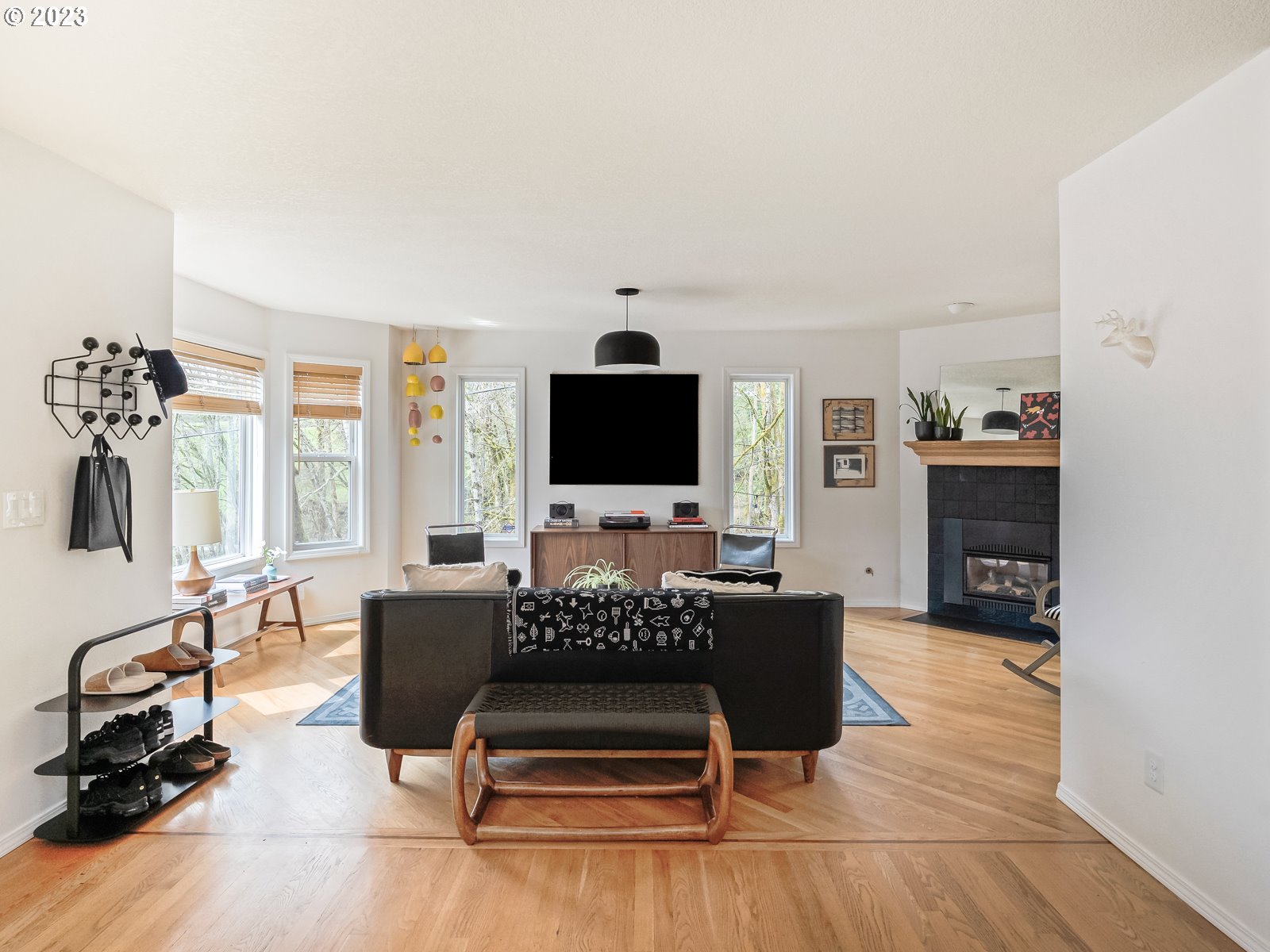 5928 Southwest Yamhill Street Portland, OR 97221 - Photo 2 of 25 a living room with furniture and a flat screen tv