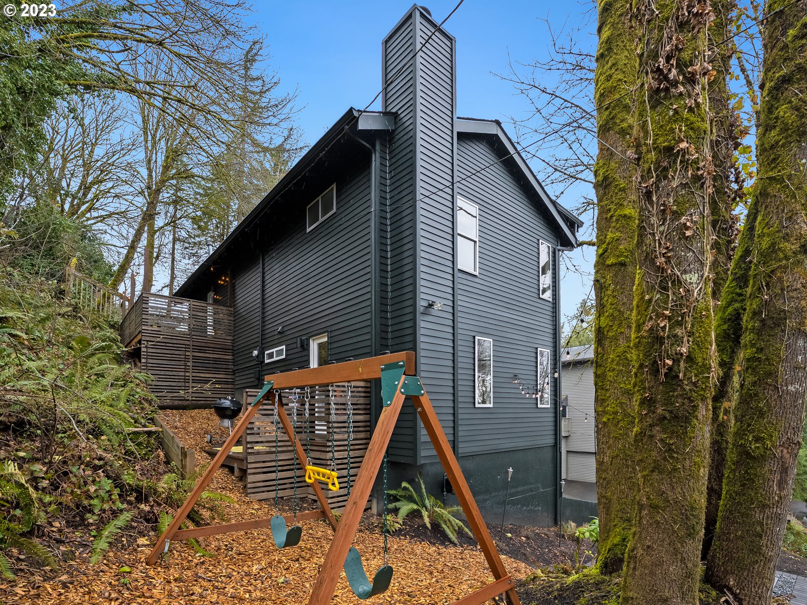 5928 Southwest Yamhill Street Portland, OR 97221 - Photo 23 of 25 a backyard of a house with seating space