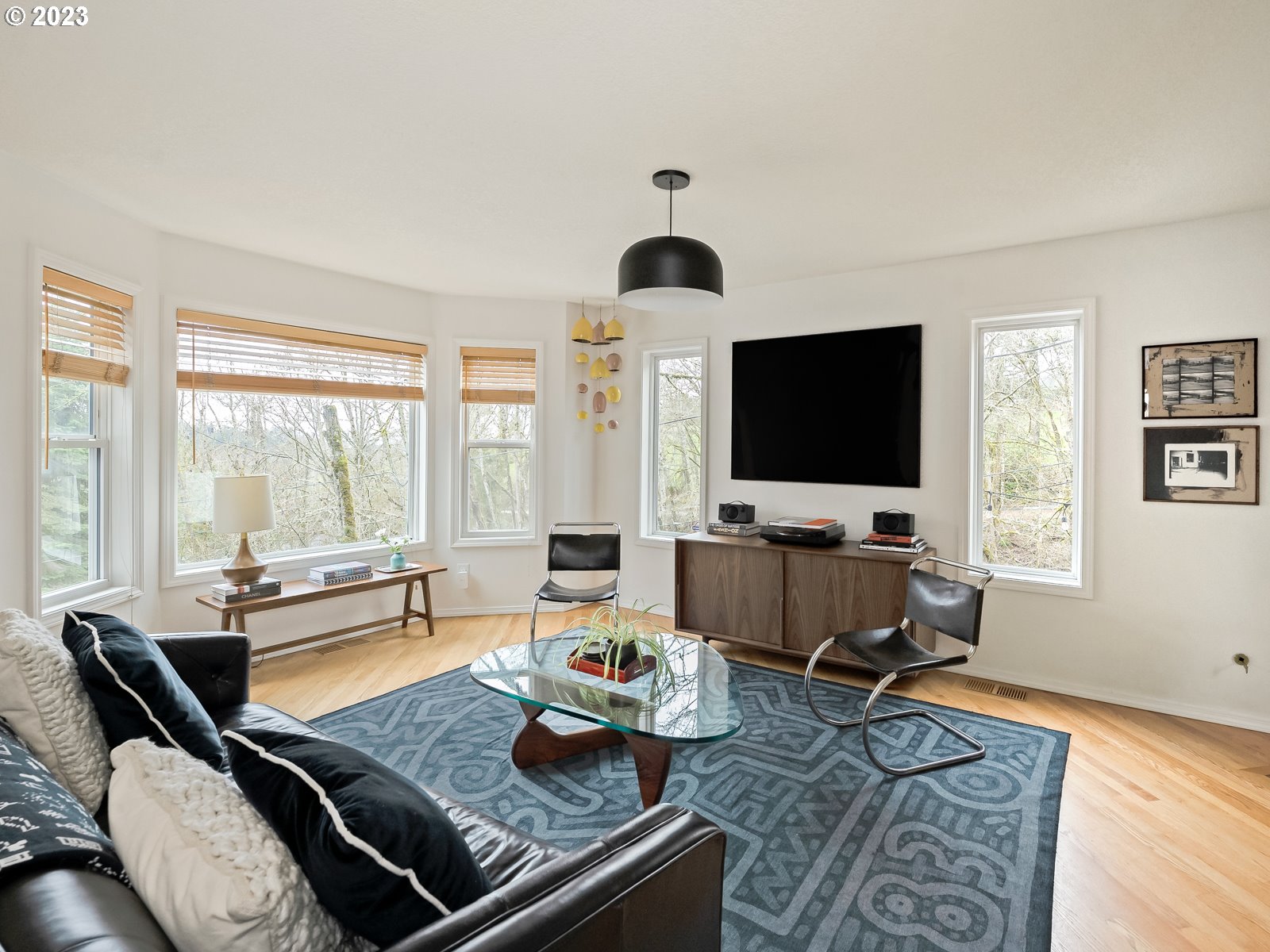 5928 Southwest Yamhill Street Portland, OR 97221 - Photo 3 of 25 a living room with furniture and a flat screen tv