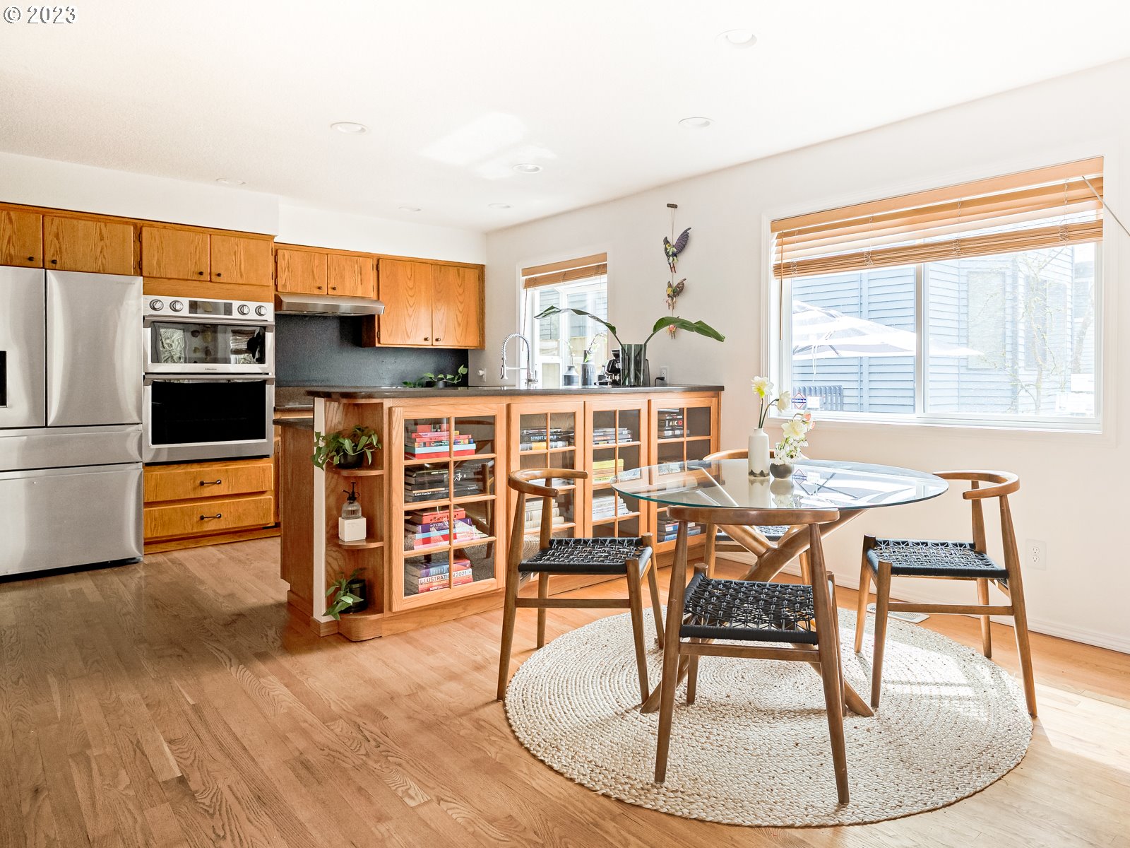 5928 Southwest Yamhill Street Portland, OR 97221 - Photo 5 of 25 a view of a dining room with furniture window and wooden floor