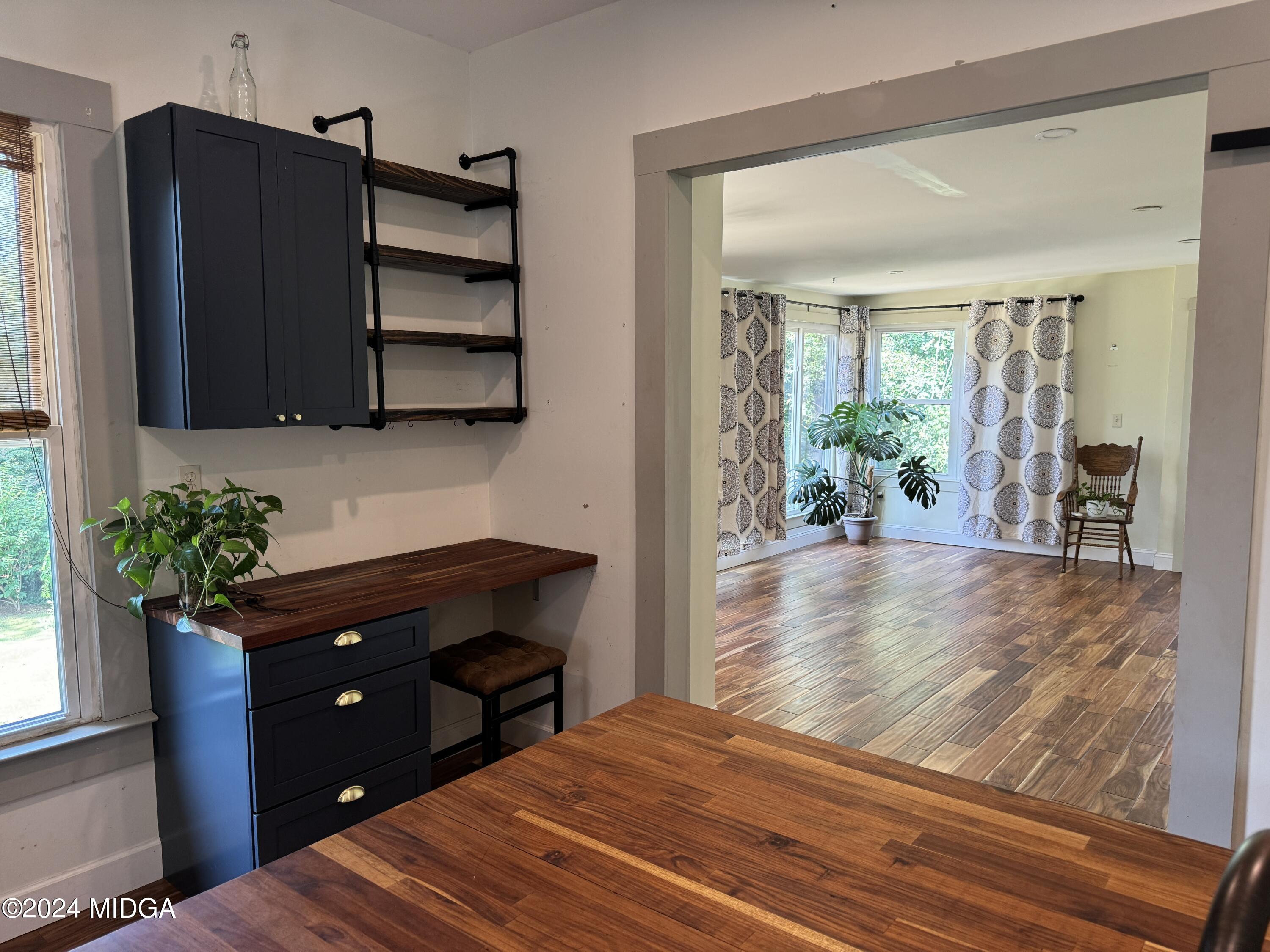 910 Laurel Avenue Macon, GA 31211 - Photo 12 of 41 a bedroom with a bed and a potted plant