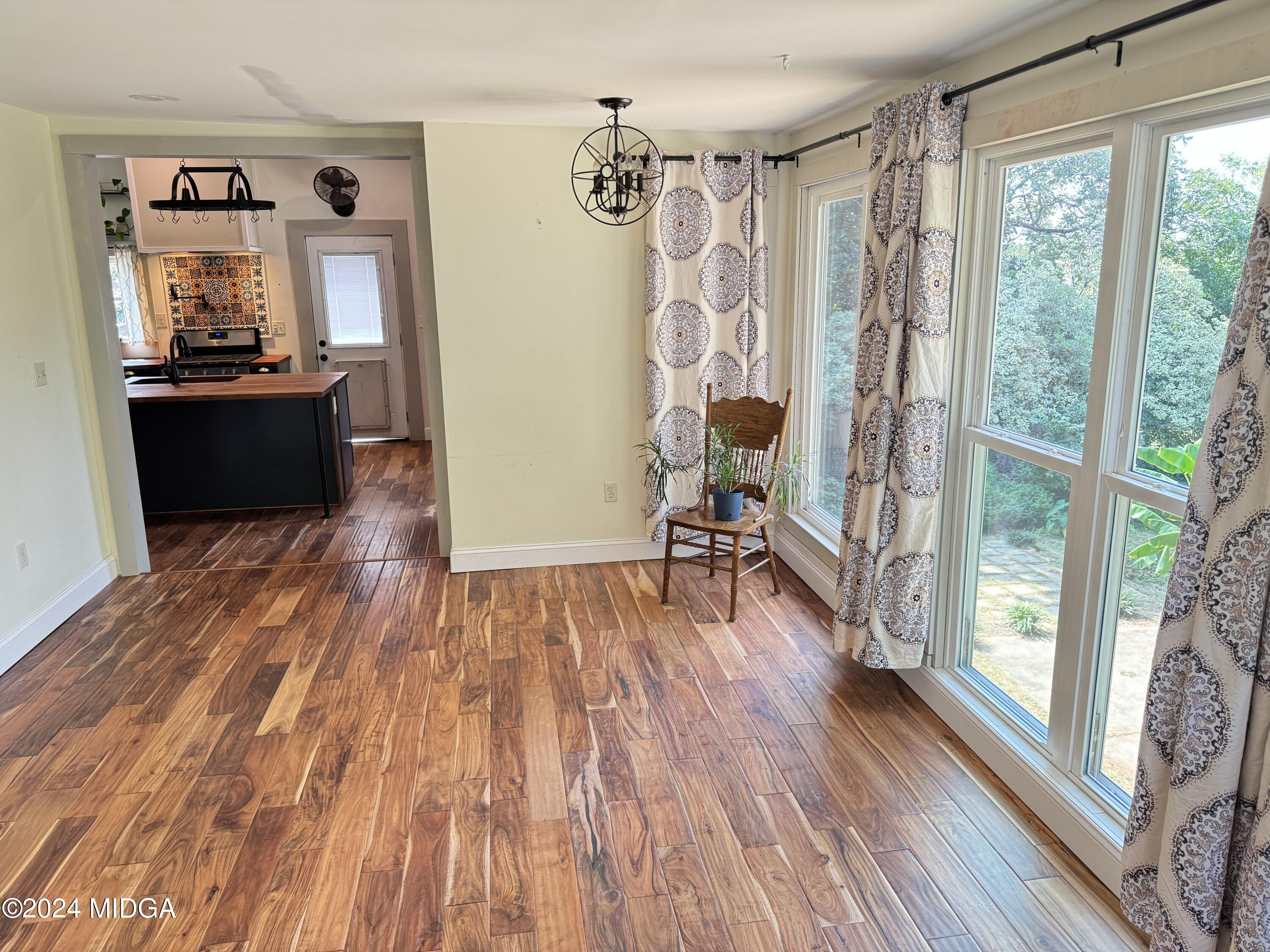 910 Laurel Avenue Macon, GA 31211 - Photo 13 of 41 a view of a room with wooden floor and furniture