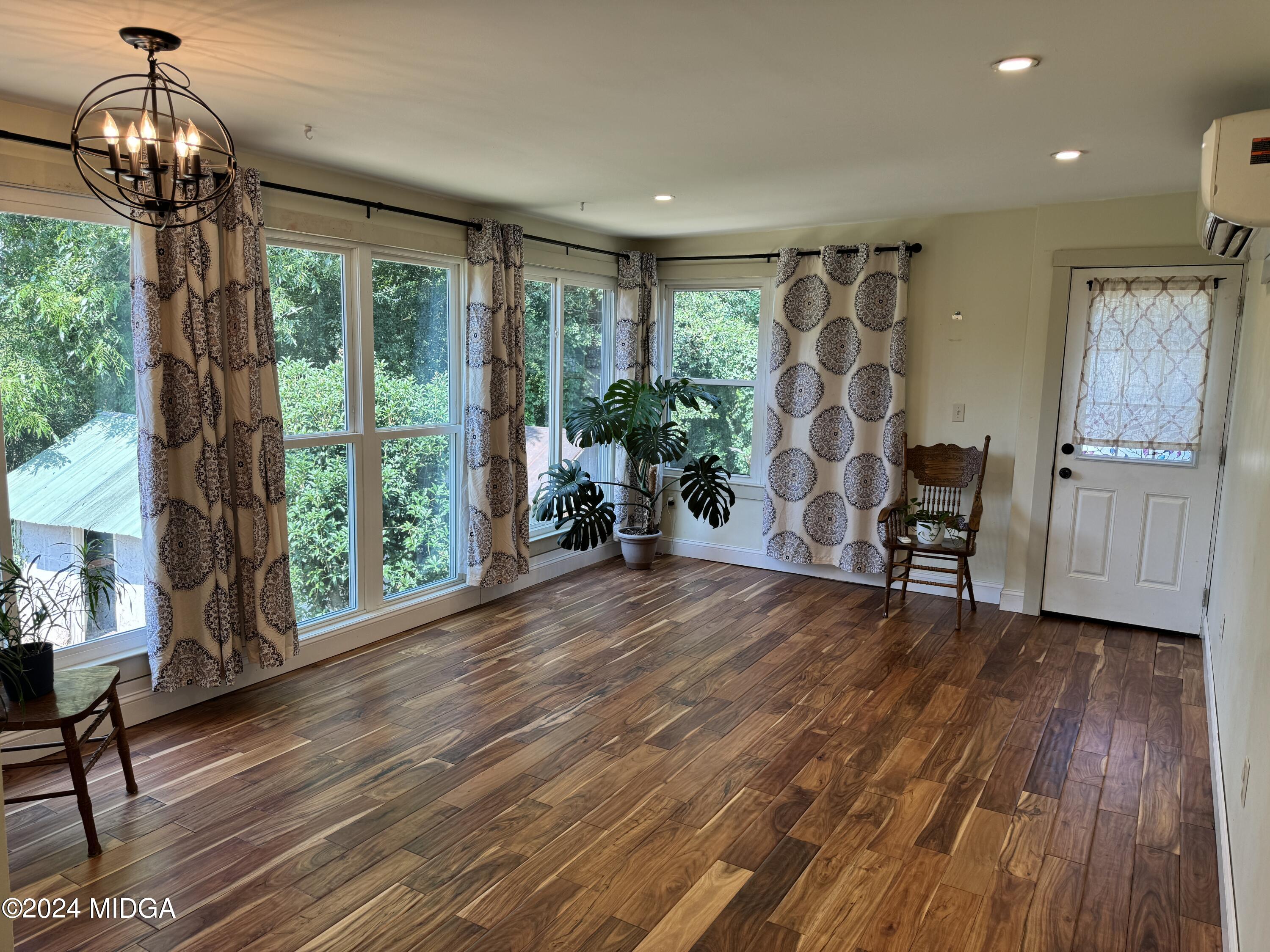910 Laurel Avenue Macon, GA 31211 - Photo 14 of 41 a view of empty room with wooden floor and fan