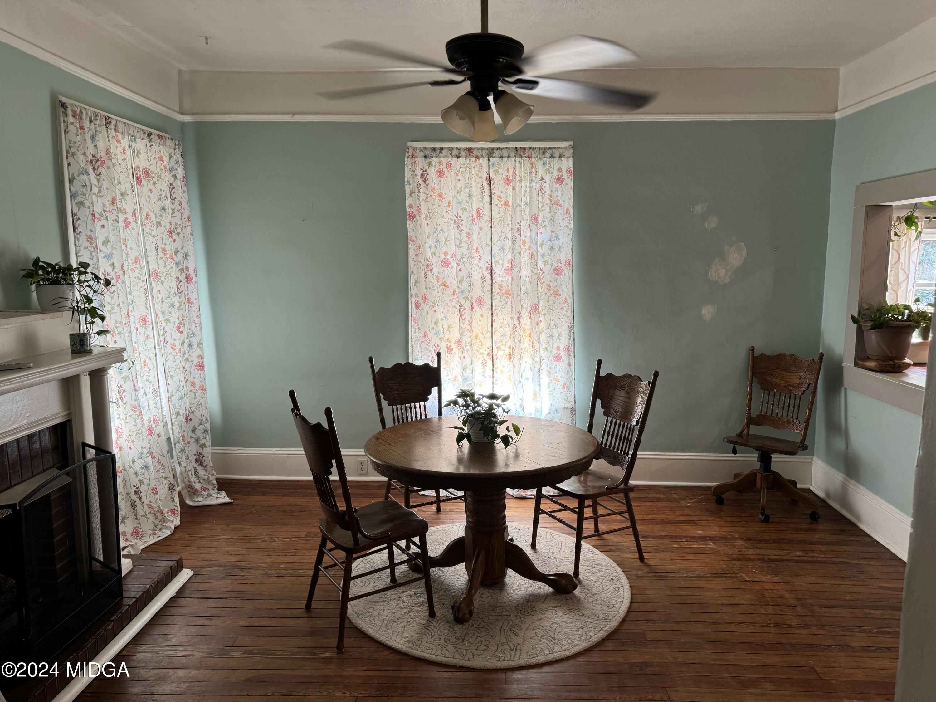 910 Laurel Avenue Macon, GA 31211 - Photo 15 of 41 a view of a dining room with furniture window and wooden floor