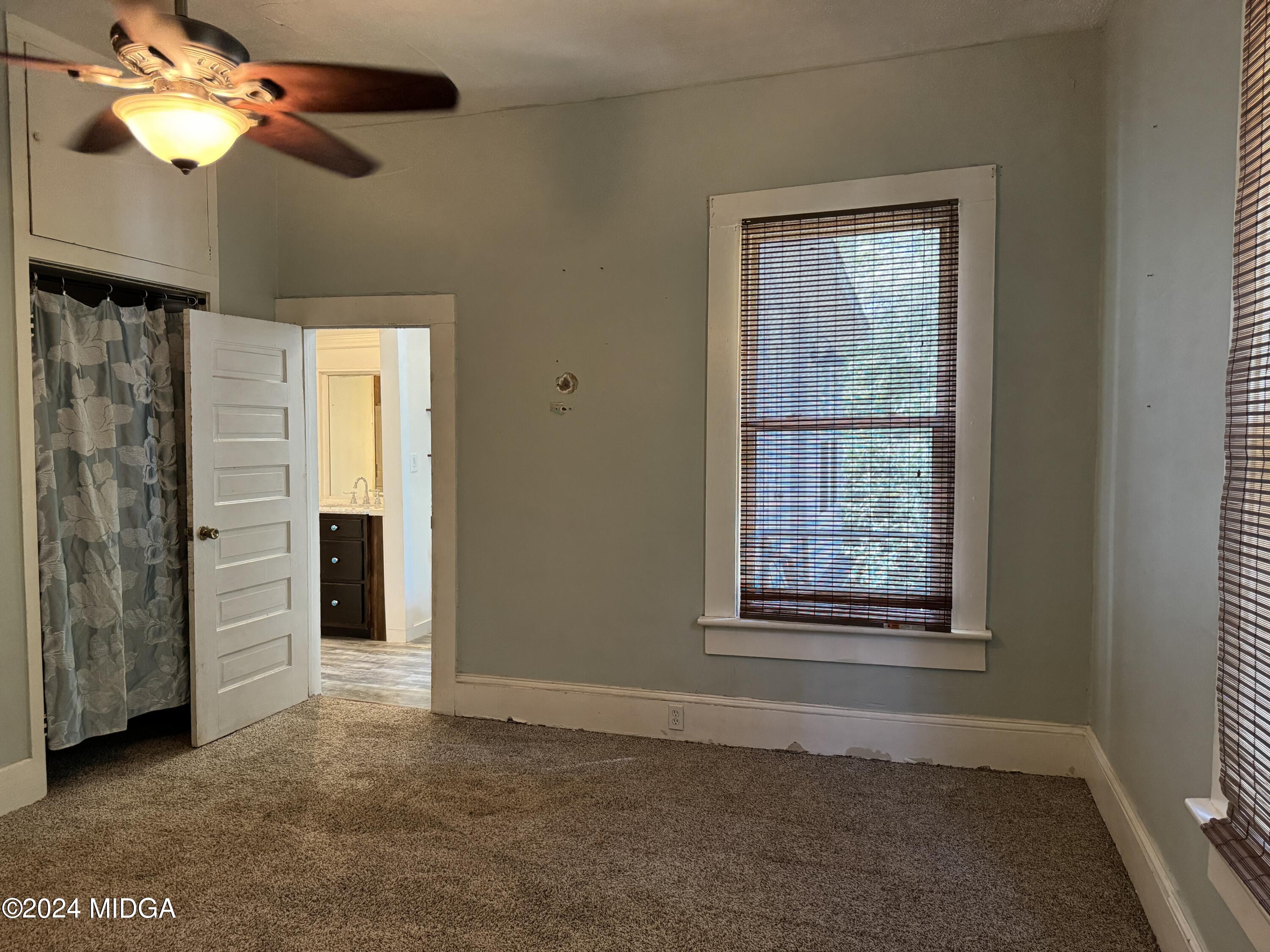 910 Laurel Avenue Macon, GA 31211 - Photo 16 of 41 a view of an empty room with a window