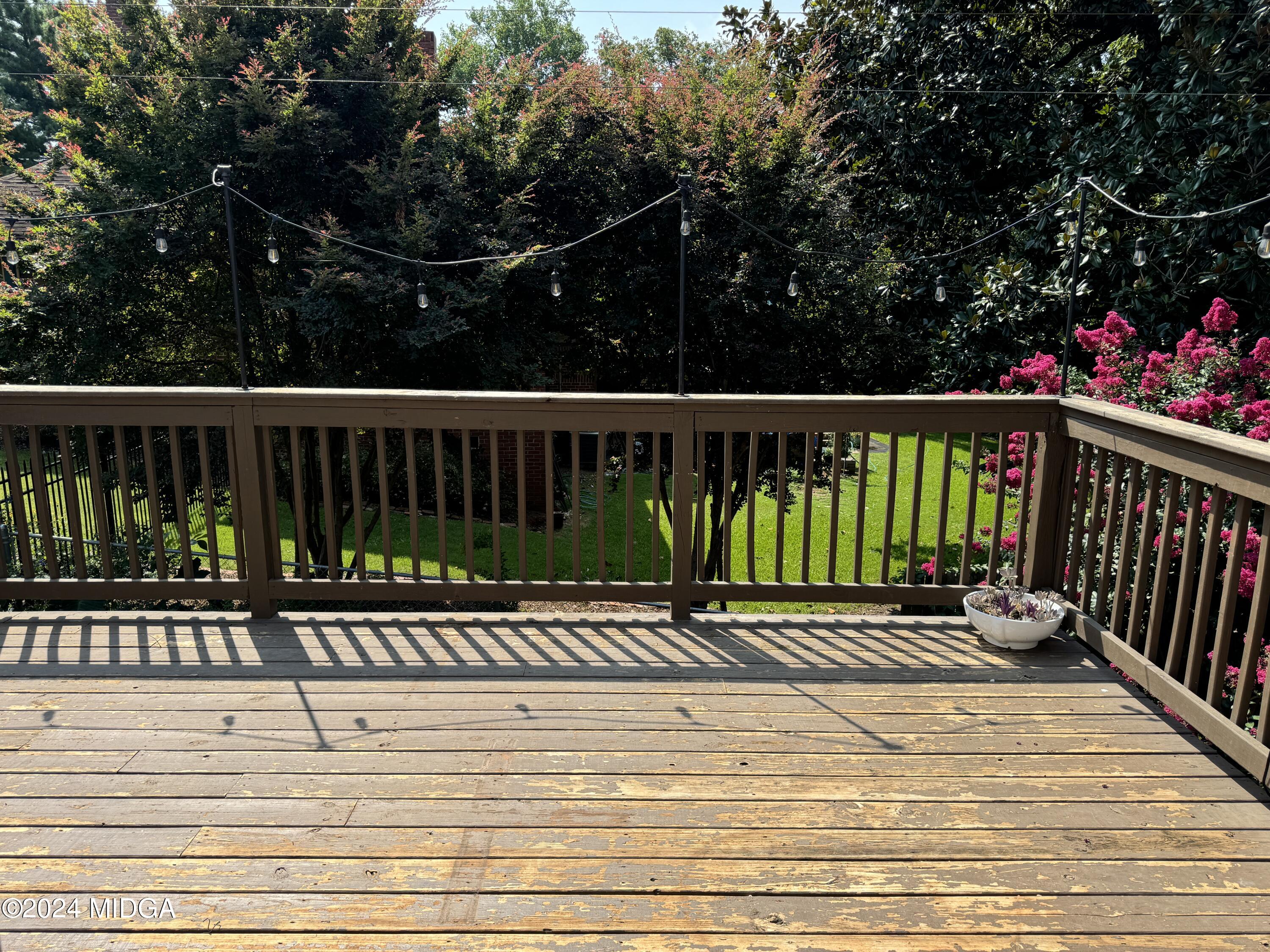 910 Laurel Avenue Macon, GA 31211 - Photo 29 of 41 a view of balcony with wooden floor and fence