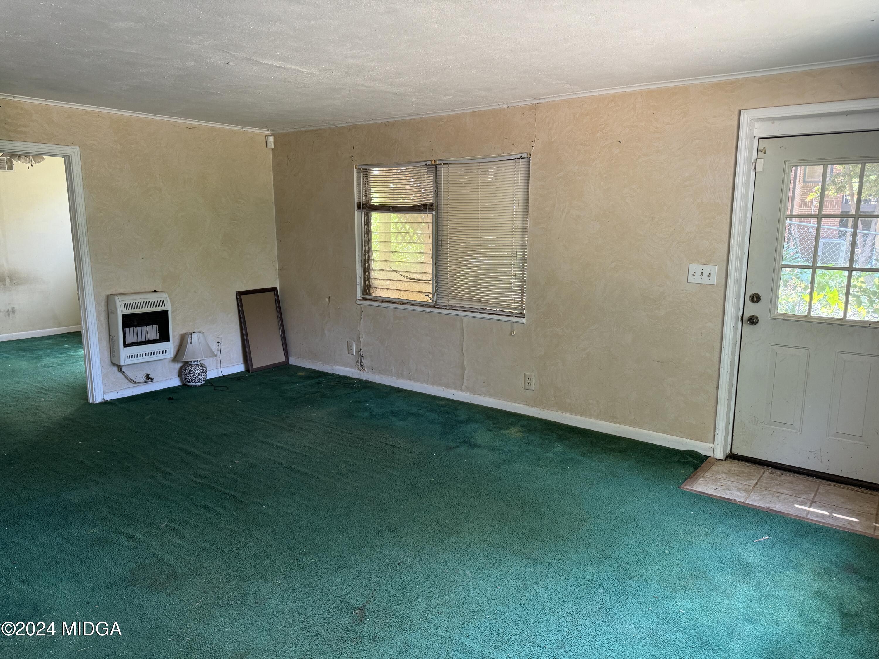 910 Laurel Avenue Macon, GA 31211 - Photo 37 of 41 a view of a bedroom with window and furniture