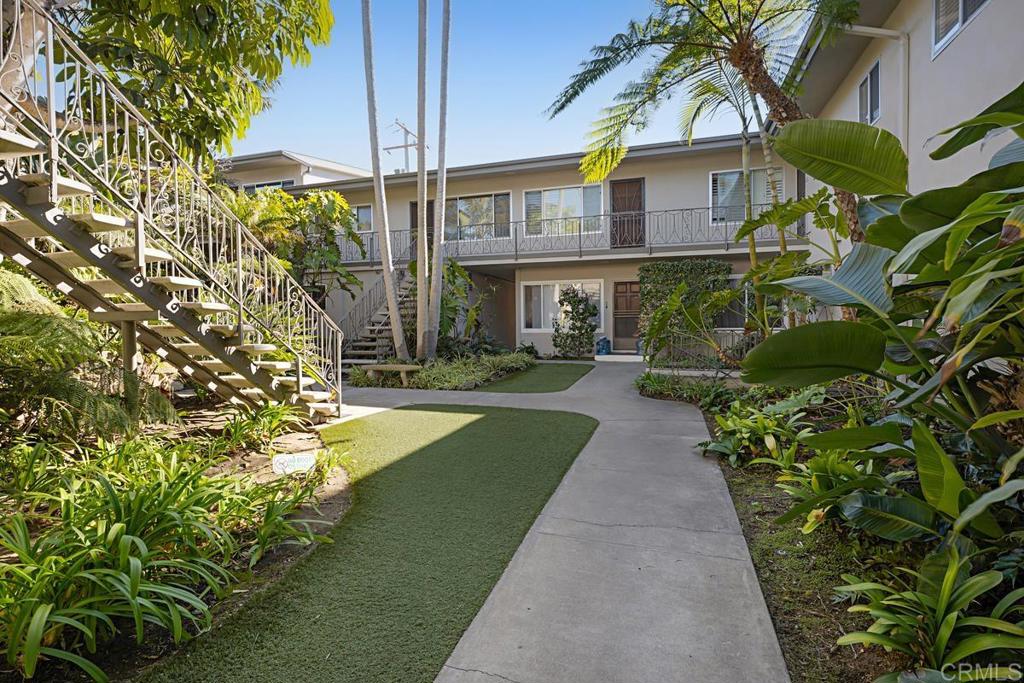 155 15th Street, Unit 19 Del Mar, CA 92014 - Photo 27 of 29 a view of a brick building next to a yard