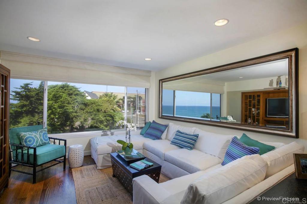 155 15th Street, Unit 19 Del Mar, CA 92014 - Photo 5 of 29 a living room with furniture and a large window
