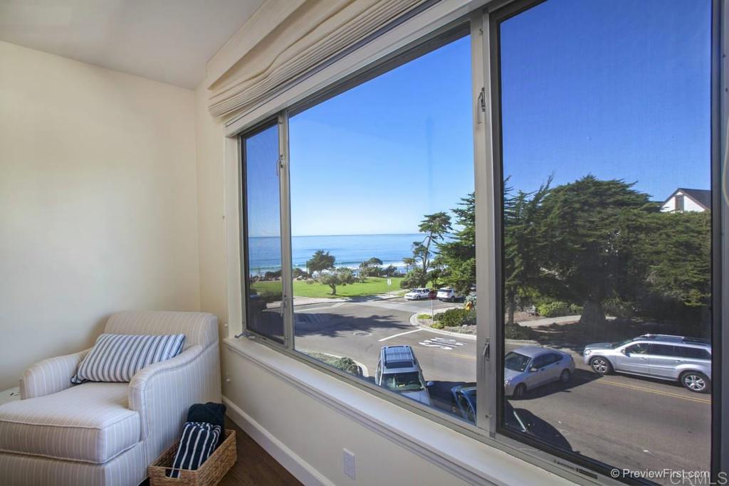 155 15th Street, Unit 19 Del Mar, CA 92014 - Photo 9 of 29 a view of a balcony with floor to ceiling windows with wooden floor