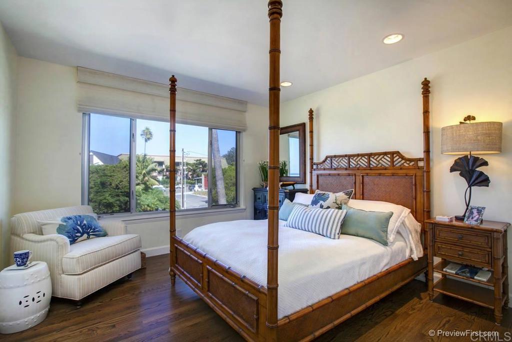 155 15th Street, Unit 19 Del Mar, CA 92014 - Photo 10 of 29 a bedroom with a bed and large window