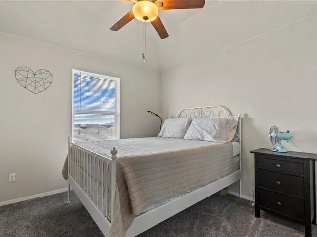 a bedroom with a bed and a cabinets