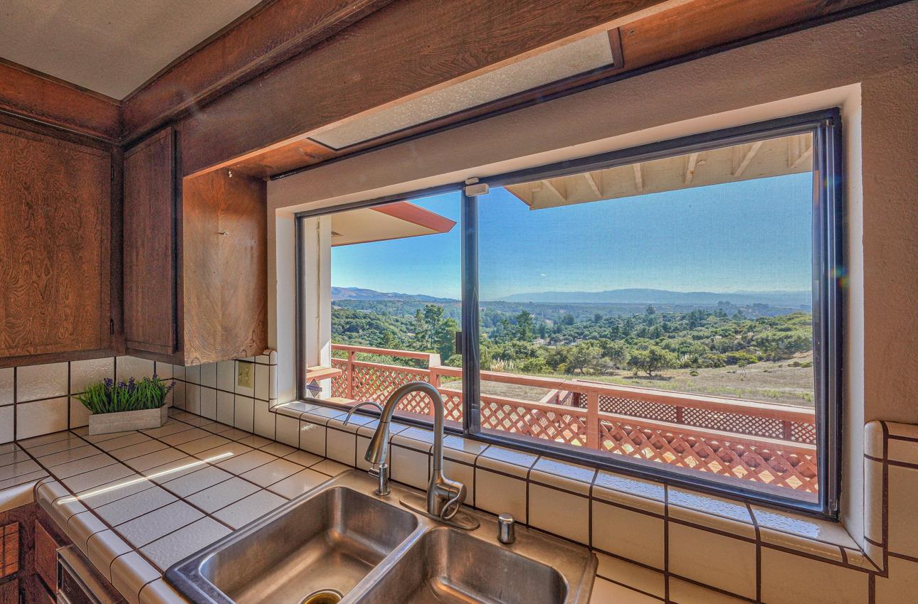 8640 Coker Road Salinas, CA 93907 - Photo 12 of 50 a view of a balcony with floor to ceiling windows with wooden floor
