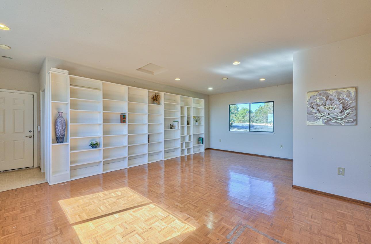 8640 Coker Road Salinas, CA 93907 - Photo 21 of 50 an empty room with wooden floor and windows