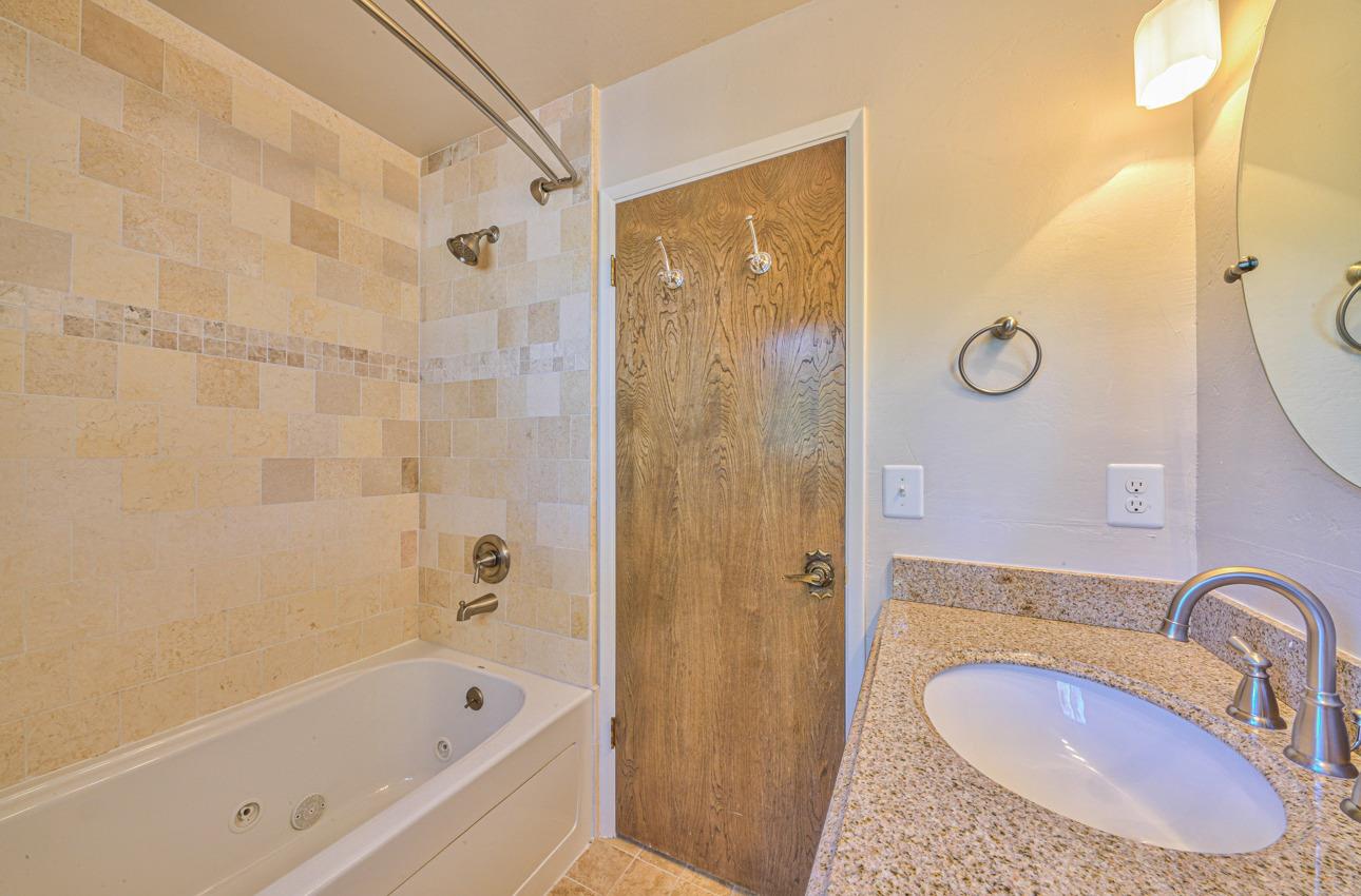 8640 Coker Road Salinas, CA 93907 - Photo 30 of 50 a bathroom with a sink and a mirror