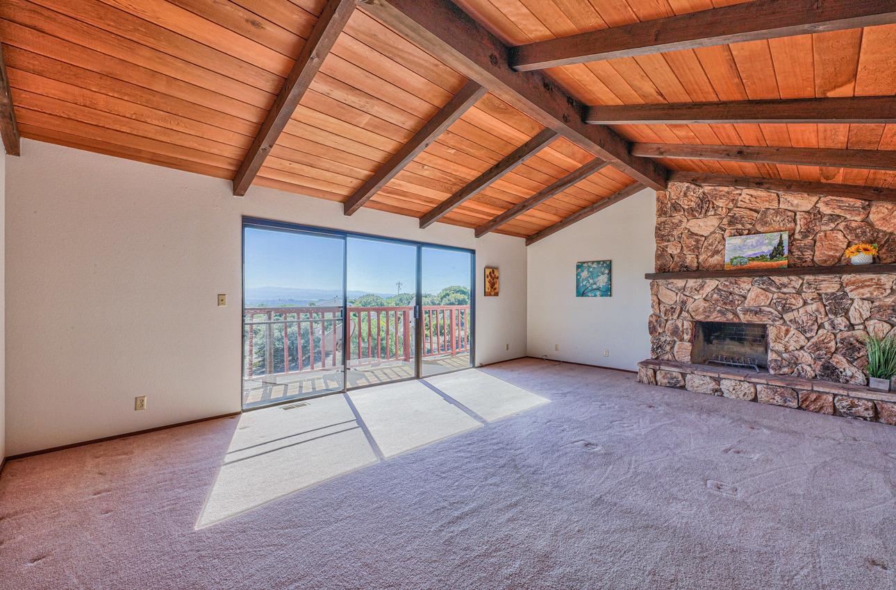 8640 Coker Road Salinas, CA 93907 - Photo 31 of 50 a view of an empty room with a fireplace and a window