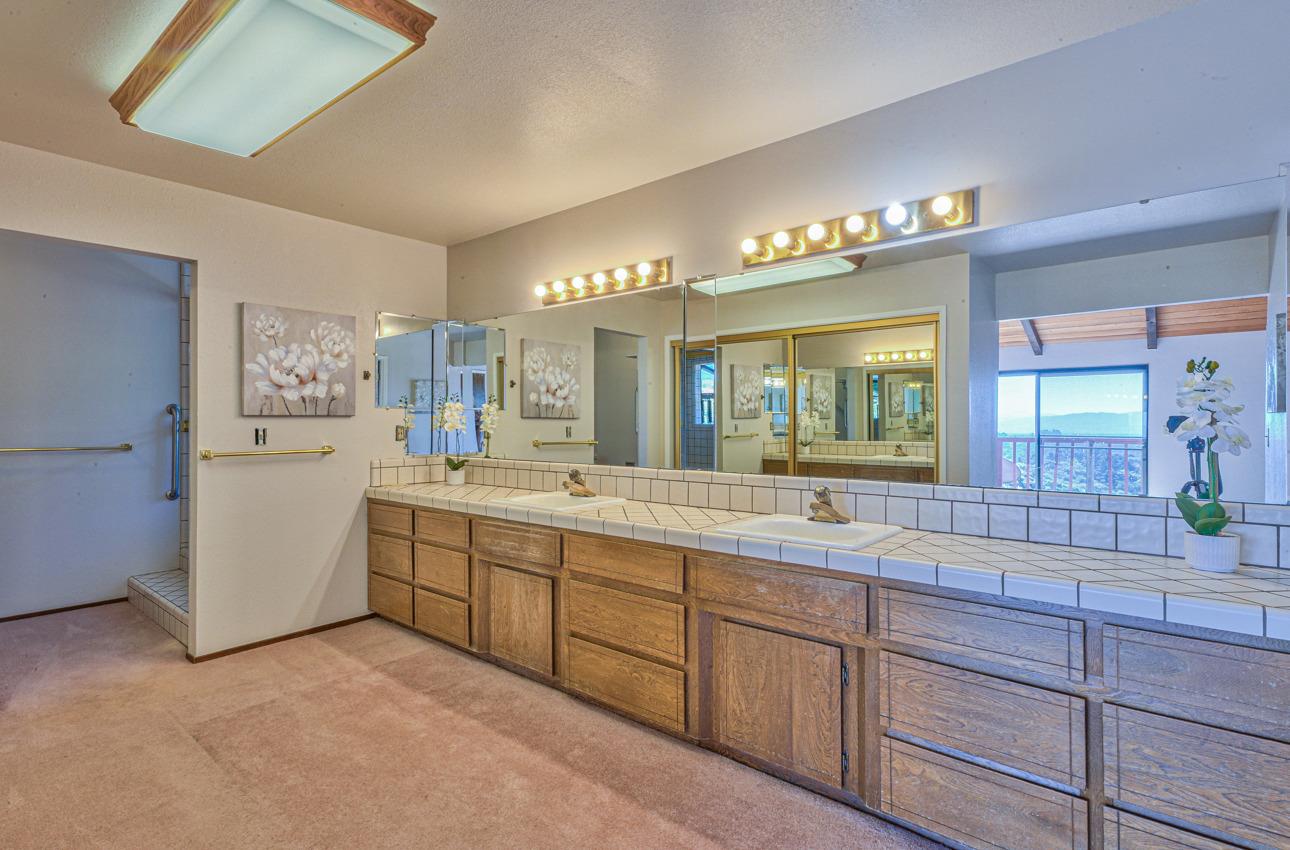 8640 Coker Road Salinas, CA 93907 - Photo 35 of 50 a spacious bathroom with a granite countertop sink mirror and shower