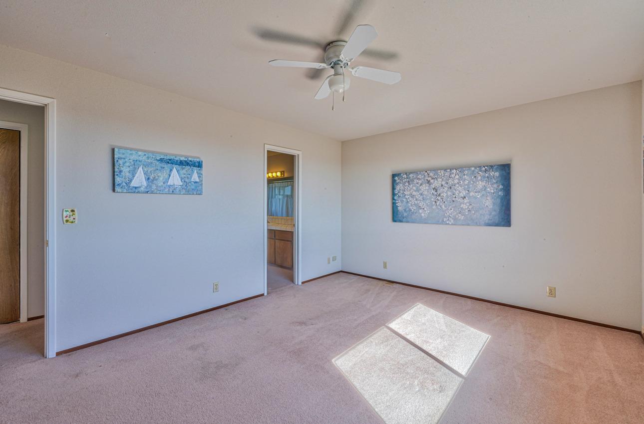8640 Coker Road Salinas, CA 93907 - Photo 39 of 50 an empty room with windows and ceiling fan