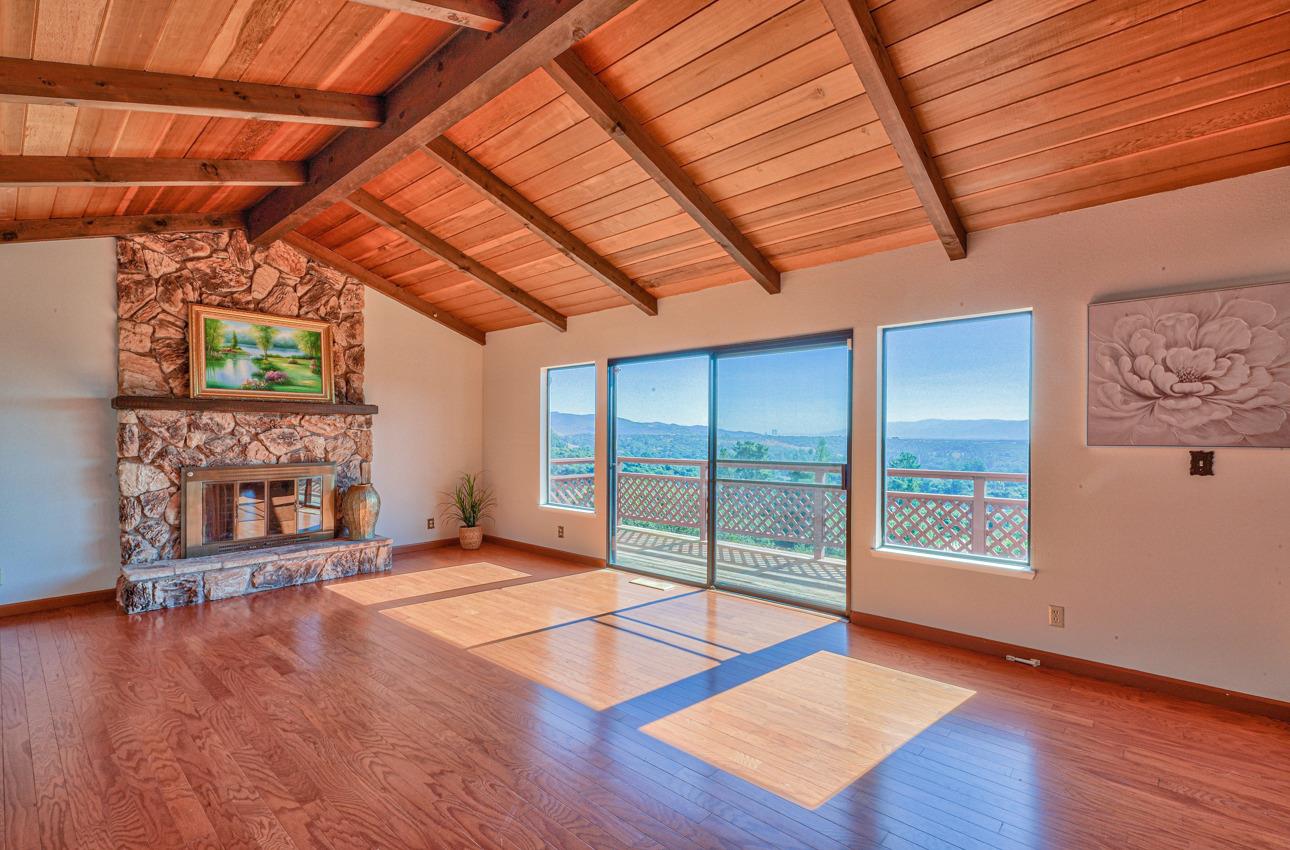 8640 Coker Road Salinas, CA 93907 - Photo 4 of 50 a view of an empty room with wooden floor and a fireplace