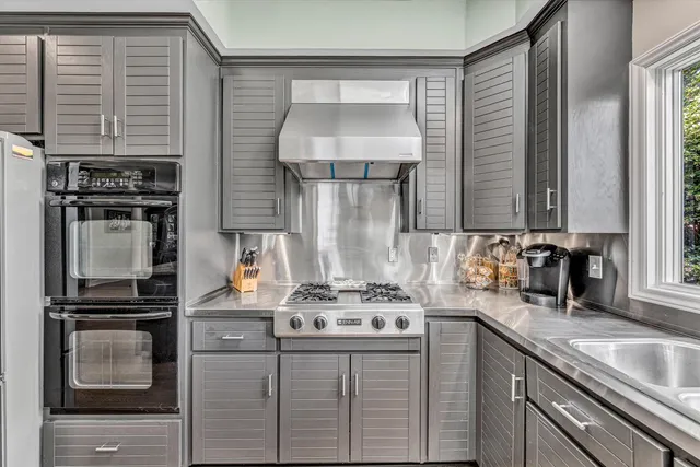 a bedroom with furniture and a book shelf