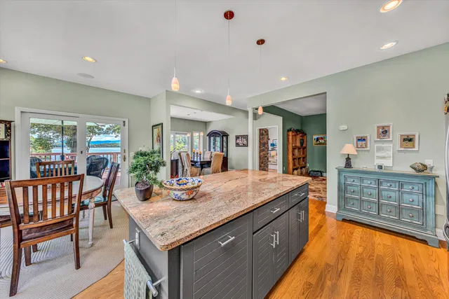 a view of balcony with wooden floor and outdoor seating