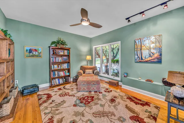 a spacious bedroom with a bed and window