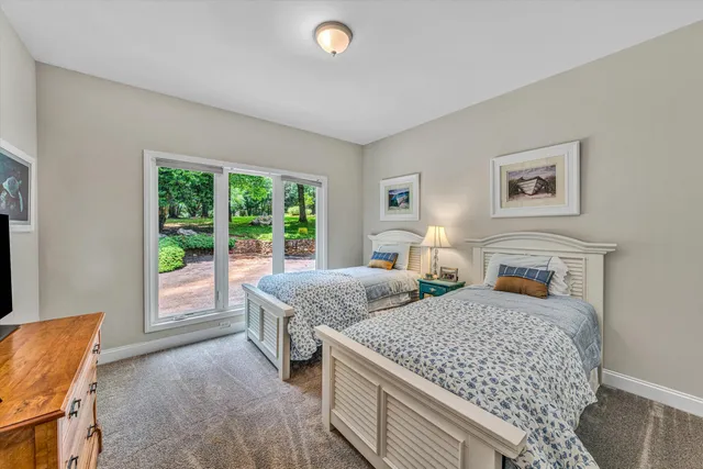 an empty room with windows and pillars in it