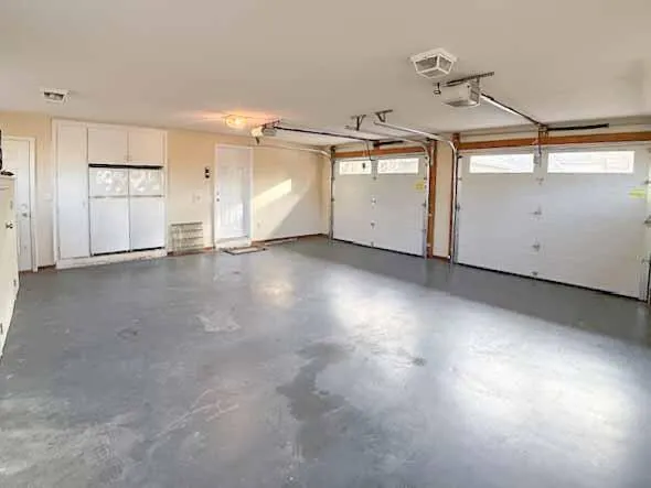 a view of a room with gym equipment and couch
