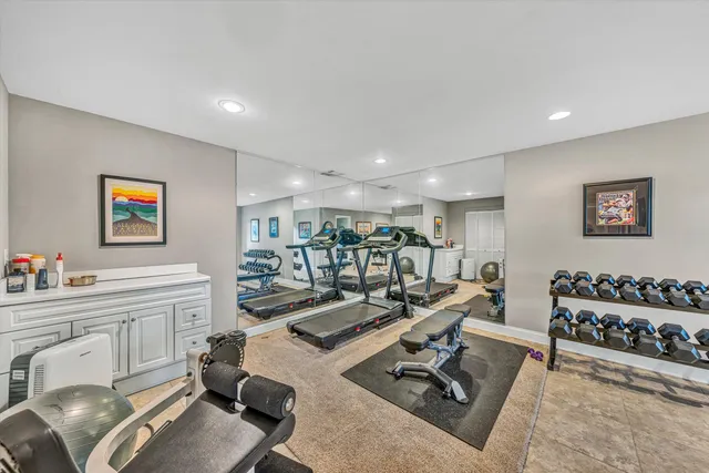 a room with a mirror and a wooden floor