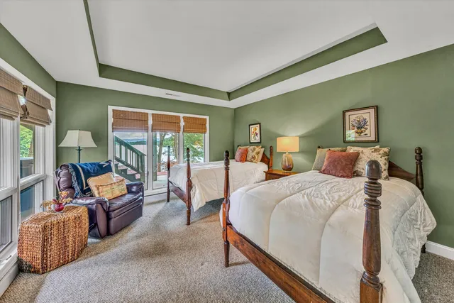 a bathroom with a granite countertop toilet and a shower