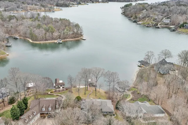 a living room with furniture large windows and a flat screen tv
